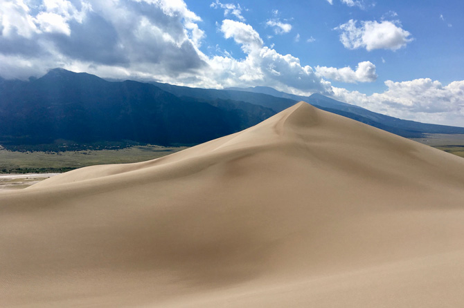 Top of a sand dune at Great Sand Dunes National Park near Alamosa, Colorado. Newly Remodeled Deluxe Lodge Rooms. More Privacy. King BED. Poach Views of Great Sand Dunes National Park.