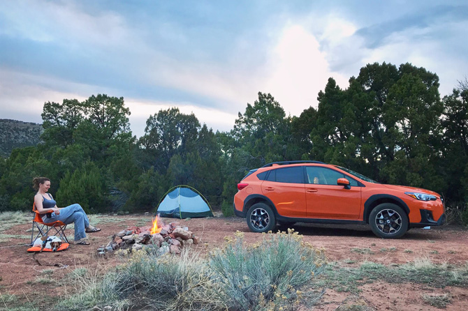 Person Car Camping with Tent and Campfire at Indian Springs Ranch and Campground in the Royal Gorge area of Colorado.