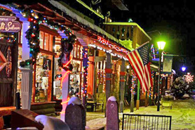 Shops decorated for Christmas along the boardwalk in Grand Lakes historic downtown, Colorado
