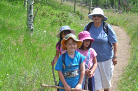 Kids hiking near the Peak to Peak Scenic Byway, Colorado.