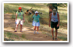 Adults hiking along the Peak to Peak Scenic Byway, Colorado Vacation Directory