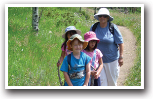 Kids hiking near the Peak to Peak Scenic Byway, Colorado Vacation Directory