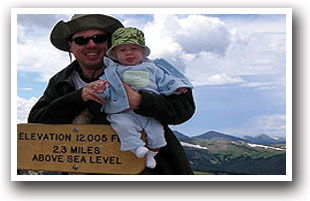 Hiker with child on Tundra World Nature Trail, Colorado.