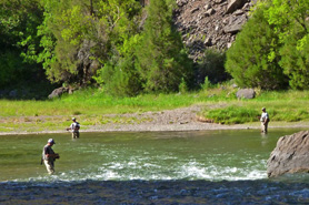 People fishing the Gold Medal waters along the East Portal Road, Colorado.