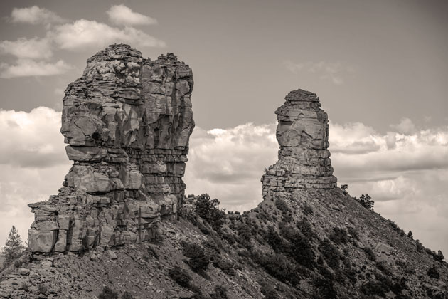 Historic Chimney Rock National Monument and Companion Rock in the Piedra River Valley near Pagosa Springs, Colorado.