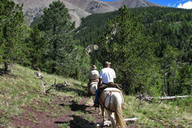 Horseback riders on the Wahatoya Trail at the East Peak of the Spanish Peaks, Colorado