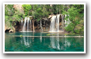 View of the famous Hanging Lake with floating log and turquoise water near Glenwood Springs, Colorado