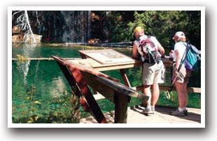 A couple reading the information board at Hanging Lake, Colorado