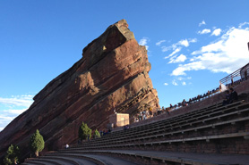 Huge outcroppings of red sandstone encircle the seating area Red Rocks National Natural Landmark Amphitheatre in Morrison, Colorado.