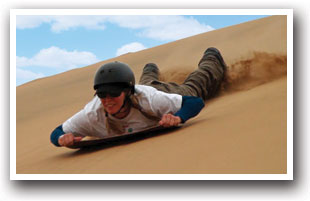 Sledding down the Great Sand Dunes, Colorado