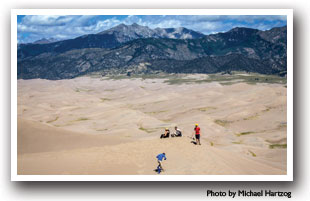 People on the Great Sand Dunes with Sangre de Cristo Mountains, Colorado, Photo by Michael Hartzog