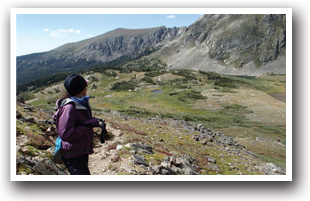 Hiker on hiking trail in Nederland, Colorado.