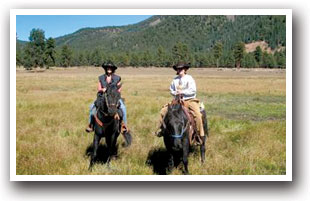 Two men Horseback riding on the Old Spanish Trail in the San Luis Valley, Colorado