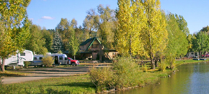 View RV-sites and Campsites next to private fishing pond at Pagosa Riverside Campground and Camper Cabins in Pagosa Springs, Colorado.