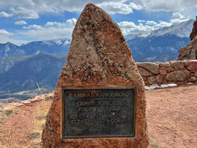 Plaque on a rock at the top Rampart Range Road near Colorado Springs , Colorado.