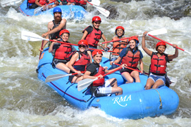Group of rafters whitewater rafting in the Cache la Poudre River Colorado