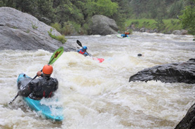 Whitewater kayaking down the Cache La Poudre River in Colorado.