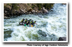 Rafters on the Eagle river going down a canyon with rapids, photo courtesy of Sage Outdoor Adventures
