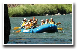 blue raft going down the blue river in colorado