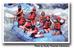 Raters whitewater rafting in the Cache la Poudre, photo by Rocky Mountain Adventure