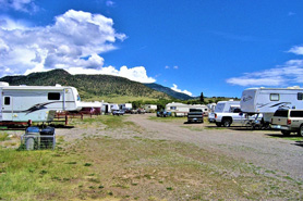 RV sites in the foothills with sunshine and blue skies at Rainbow Lodge, Cabins and RV Park in South Fork Colorado.