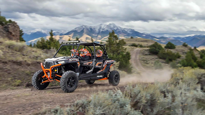 Polaris ATV-UTV rental cruising along off-road mountain trail from Rimrock Adventures RV Park and Rentals in Naturita, Colorado.