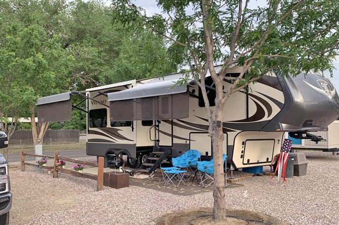 Spacious oversized RV sites with trees, gravel and concrete pad at Silver Sage RV Park in Rangely, Colorado