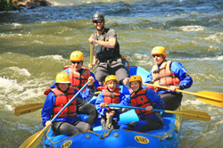 Family rafting the Clear Creek river in Colorado