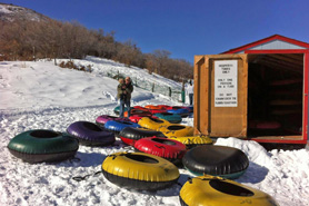 Getting the tubes ready for some tubing hill fun at Hesperus Ski Area near Durango, Colorado.
