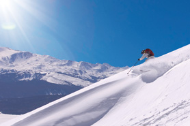 Skiing in sunlit powder at Chicago Ridge, Leadville, Colorado