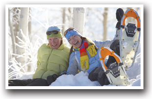 Two friends snowshoeing near Sunlight Mountain Resort in Colorado.