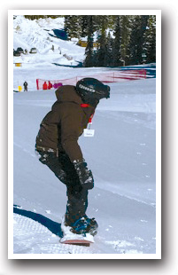 Snowboarding down a hill at Winter Park Ski Area in Colorado
