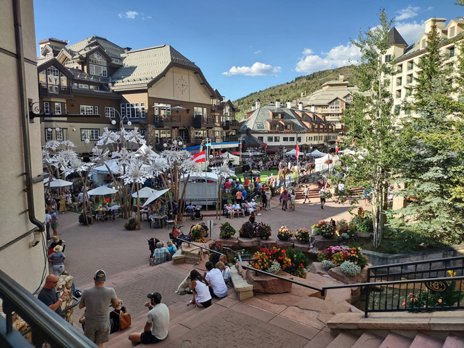 People gathering and relaxing in the Beaver Creek Plaza at Park Hyatt Mountain Lodges in Beaver Creek, Colorado. Beaver Creek and Vail Vacation Rentals.