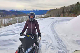 Snowmobiling on trail around Sylvan Lake State Park near Eagle, Colorado.