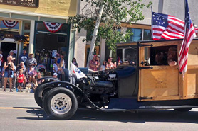 Old hot rod going down Main Street during 4th of July Parade in Westcliffe, Colorado.